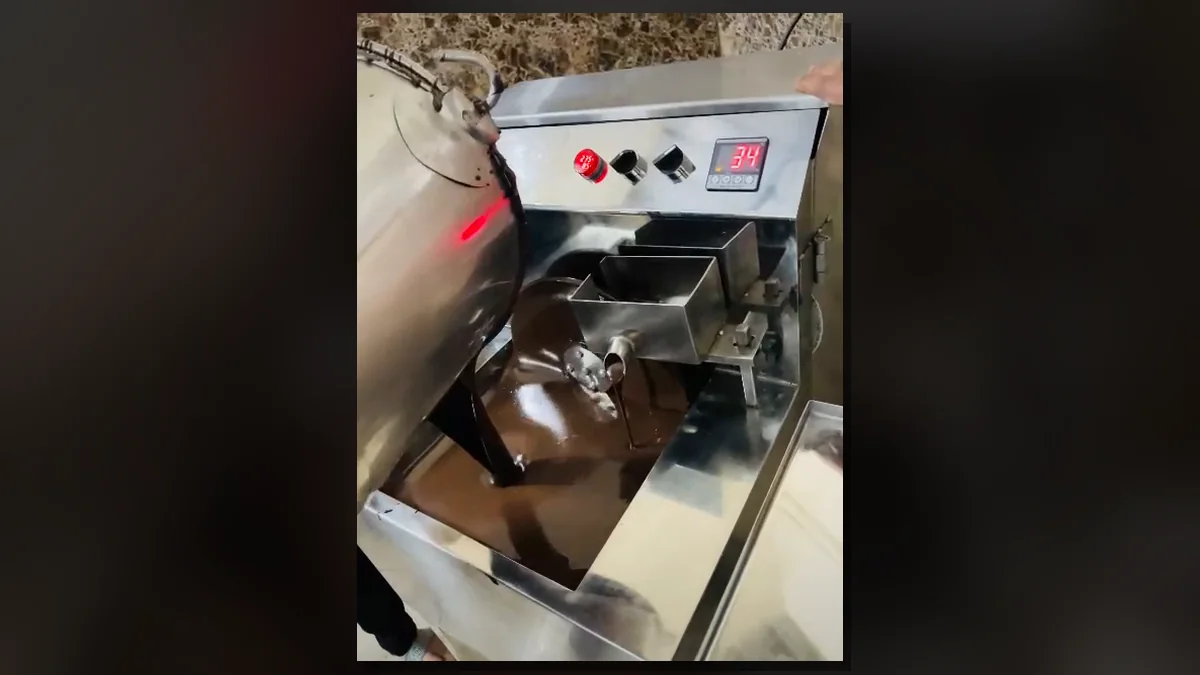 Chocolate loading and melting in a Culinext wheel tempering machine
