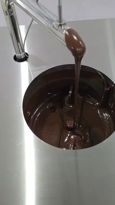 Chocolate circulating inside a Culinext continuous tempering machine bowl